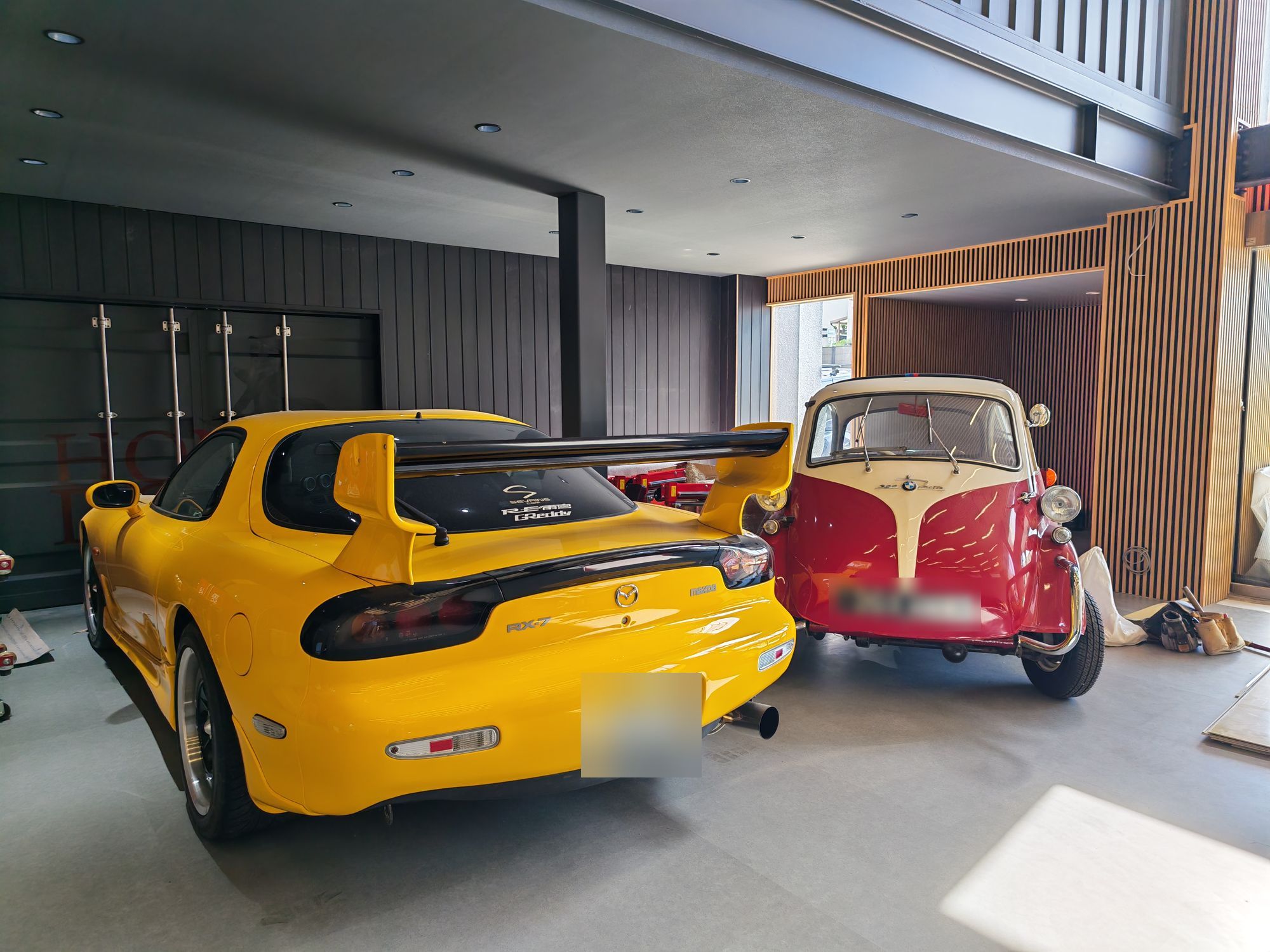 Mazda RX-7 and BMW Isetta in the HONDO MOTOR ART showroom