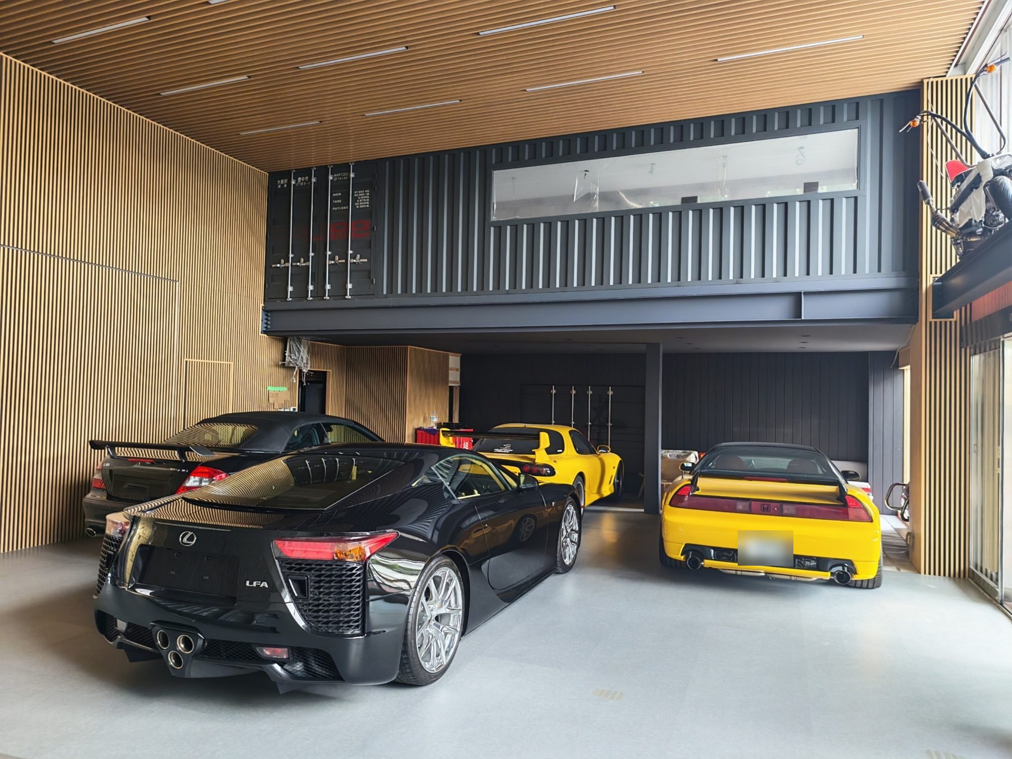 HONDO MOTOR ART showroom in Hannan, Osaka, with a Lexus LFA, Mazda RX-7 and Honda NSX
